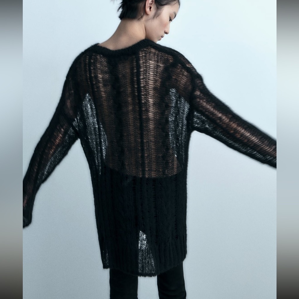 Open work cable knit sweater